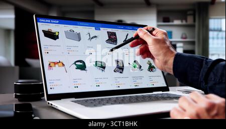 The Senior Consultant Uses His Laptop For Online Shopping Stock Photo