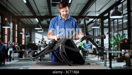 Skilled Craftsman Expertly Assembling New Office Furniture In Business Space. Stock Photo