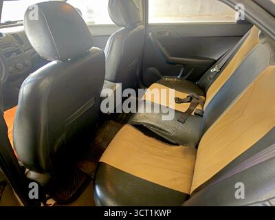 Cairo, Egypt, September 27 2025: Torn and old seat covers upholstery of a car, old used cover materials inside a car Stock Photo