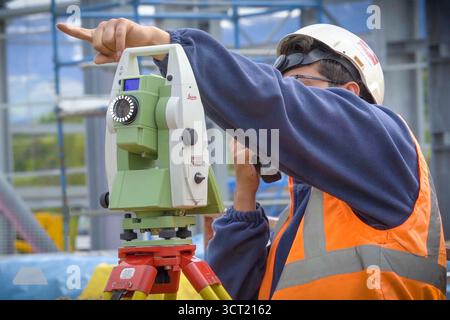 Moscow, Russia - May 22, 2018: Workers in helmets on the construction site. Construction works Stock Photo