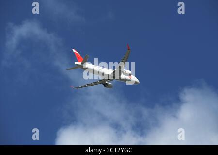 Airplane in the blue sky. Stock Photo