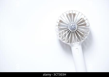 Mini electric fan with handle isolated on white background Stock Photo