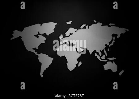 Minimalist World Map Silhouette Displayed on a Smooth Grey Background for Modern Decor, Education, or Travel Themes Stock Photo