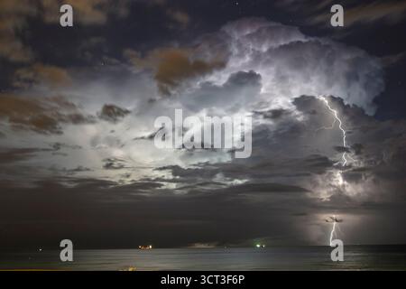 Miami Beach Florida,rainstorm thunderstorm storm,clouds clouds sky weather over Atlantic Ocean,lightning streak night Stock Photo
