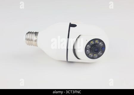 This image shows a white smart bulb-shaped IP camera against a plain white background. Stock Photo