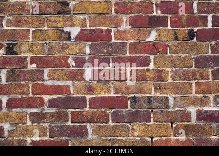 A red brick wall material with gray cement joints Stock Photo