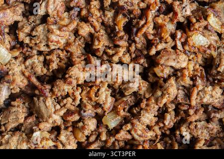 Fried lean beef steak mince with onions fried background backdrop. Stock Photo