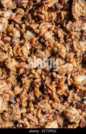 Fried lean beef steak mince with onions fried background backdrop. Stock Photo