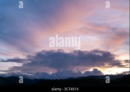 PÉREZ ZELEDÓN, SAN JOSÉ PROVINCE, COSTA RICA: Storm clouds gather over a ridge in the mountain rainforest of Pérez Zeledón, Costa Rica. Stock Photo