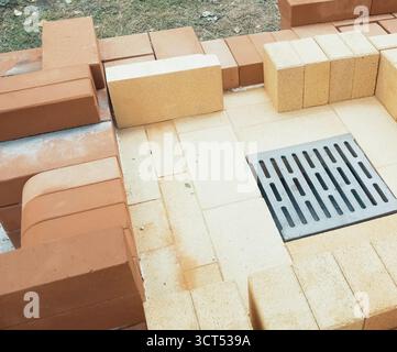 a Construction of red brick, brick masonry. Stock Photo