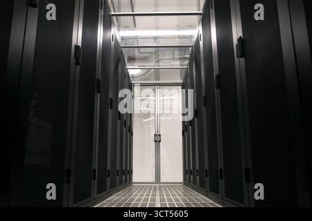 Corridor is the date of the center. walls with servers in cabinets Stock Photo