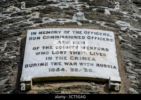 White marble Crimean War memorial plaque on stone tower wall at Round Tower Ferrycarrig, County Wexford, Ireland Stock Photo