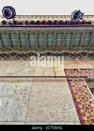Caption: Architectural detail of a Tangier building featuring a colorful cornice, mosaic tile strip, marble wall panels. Taken: 3 October 2025 Stock Photo