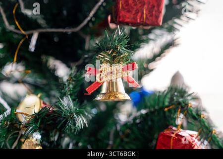 Beautifully decorated Christmas tree with lights and ornaments, creating a warm festive atmosphere for Christmas and New Year celebration. Stock Photo