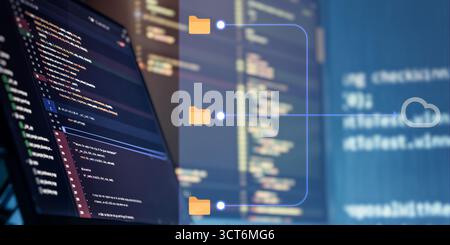 Programming screen with cloud upload icons and folder paths, symbolizing cloud storage, version control, and software deployment processes. Stock Photo