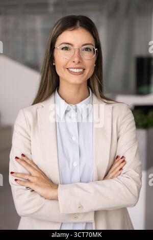 Positive beautiful Latin business leader woman looking at camera Stock Photo