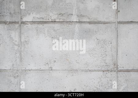 Grey textured concrete wall with grid lines Stock Photo
