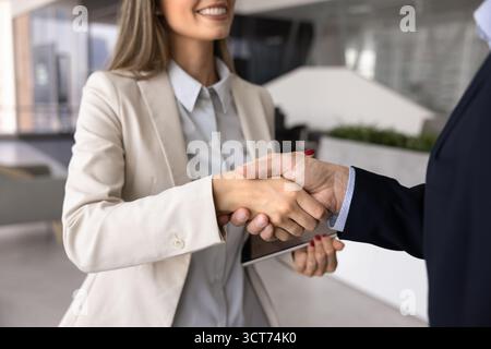 Handshake of business man and woman meeting in office Stock Photo