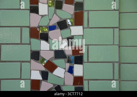 Abstract background with colorful ceramic mosaic made of tiles and glass pieces. Ideal for design, architecture, and decoration concepts. Stock Photo