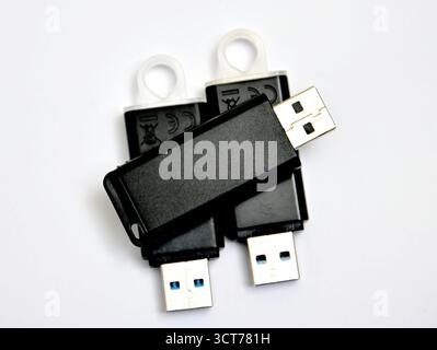 black usb flash drives on a white background. Stock Photo