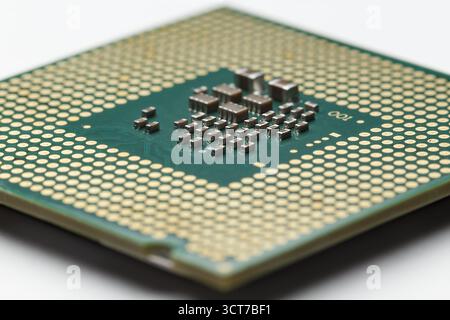 The back of the CPU. A diagonal view at a low angle with a shallow depth of field. Stock Photo