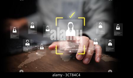 Human resources manager analyzing female applicant profile through virtual interface with world map. Digital recruitment, global talent acquisition, a Stock Photo
