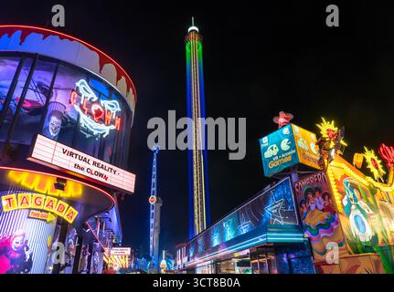 Vienna Austria - September 12 2025: Illuminated Amusement Park Rides at Prater Park at Night in Vienna Austria Stock Photo