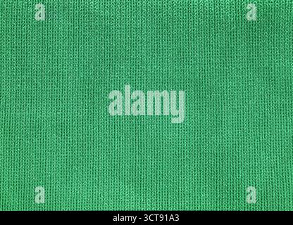 A green fabric with a pattern of lines is displayed. The fabric is made of a material that is soft and comfortable to touch. The lines on the fabric a Stock Photo