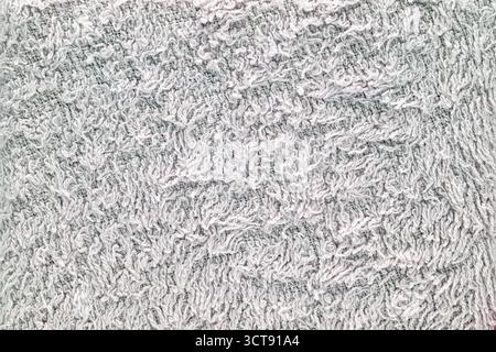 A white towel with a fuzzy texture. It is a close up of the towel Stock Photo