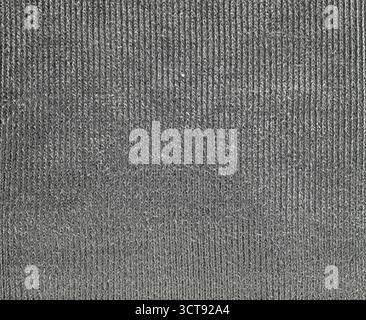 A black and white striped fabric with a grey background. The stripes are very close together and the fabric appears to be very thin Stock Photo