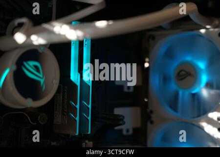 High-performance gaming PC components with glowing lights in a modern setup Stock Photo