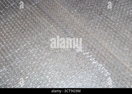 A close-up of bubble wrap, highlighting its texture and protective properties. Textured background. Stock Photo