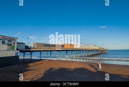 Paignton, Devon, seaside view of the pier, evening sunlight, blue sky Stock Photo