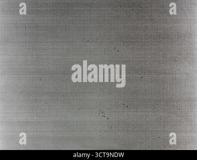 Brushed metal gray background with subtle blue specks for modern industrial design and photography Stock Photo