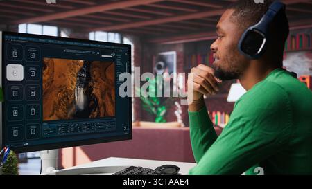Computer screen displays digital visuals generated through AI. Young person uses software combining data and machine learning, text prompts to design graphics at home office. Camera B. Stock Photo