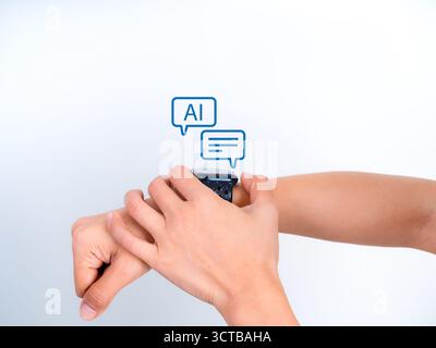 AI chatbot assistant speech bubble interface on smartwatch held by human hands. Concept of modern wearable technology with virtual communication and a Stock Photo