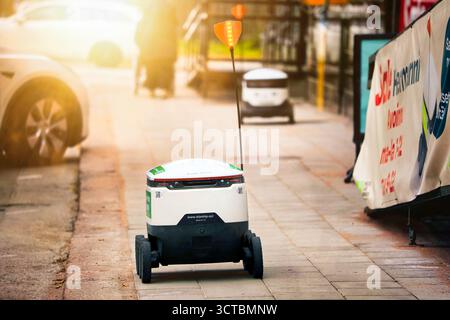 Starship Technologies self-driving food delivery robot near the Finnish S-Group store, 2nd robot on the background. Salo, Finland. Oct 3, 2025. Stock Photo