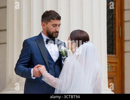 Bride and groom posing outdoor in their wedding day Stock Photo