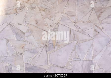 Abstract background of laying pieces of marble in various shapes for garden paths. texture. Sample marble texture and construction work. A copy space. Stock Photo