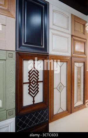 Samples of kitchen furniture fronts in different styles, colors and materials. A display case with a collection of furniture doors from classic to mod Stock Photo