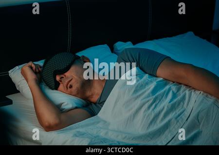 Man wearing a mask over his eyes Stock Photo - Alamy