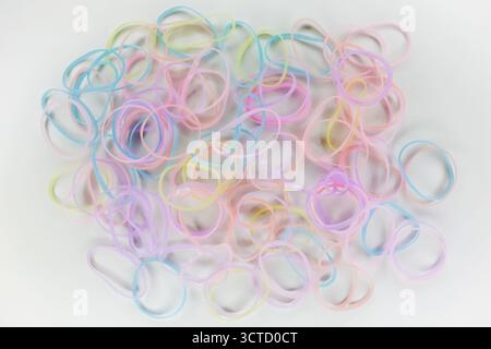 Pile of pastel color rubber bands isolated on white background Stock Photo