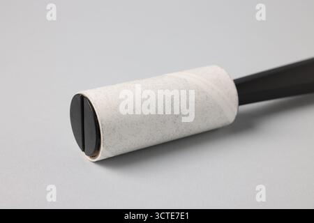 One lint roller on light grey background, closeup Stock Photo
