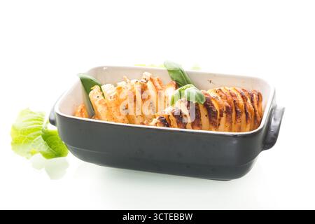 Classic potatoes with lard, baked until golden brown. Stock Photo