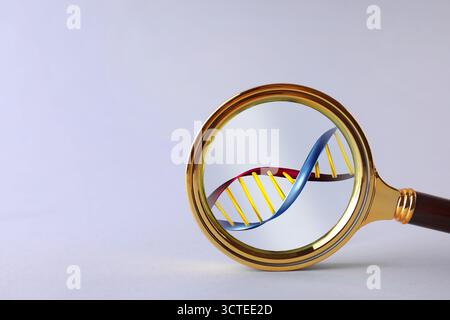 DNA spiral in magnifying glass on light grey background. Genetic analysis and research Stock Photo