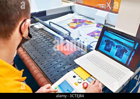 Digital automatic laser cutting systems for fabric and paper Stock Photo
