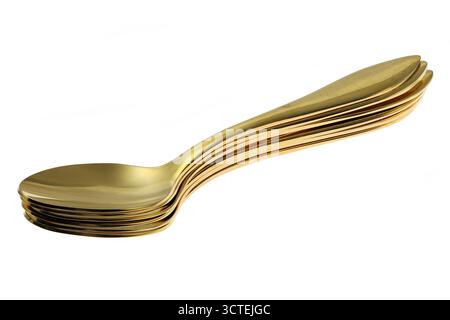 golden spoons isolated on white background Stock Photo