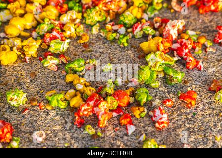 A Sweet Mess on the Pavement Colorful Popcorn Spilled on the Ground Stock Photo