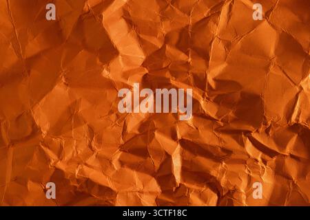Texture, orange background made of crumpled paper Stock Photo