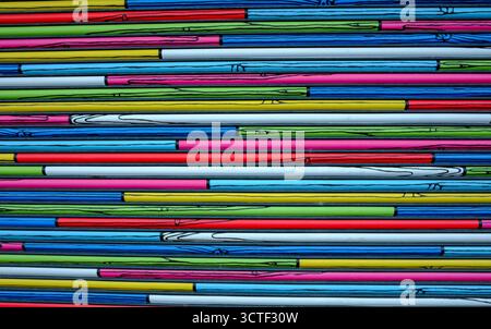 Colorful lines create a pattern on a surface, showing various shades and designs from a close view in a bright setting Stock Photo